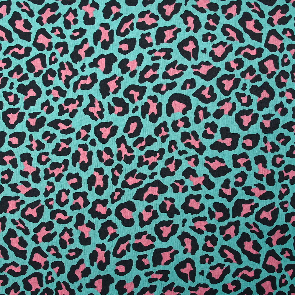Coton imprimé léopard rose fond turquoise