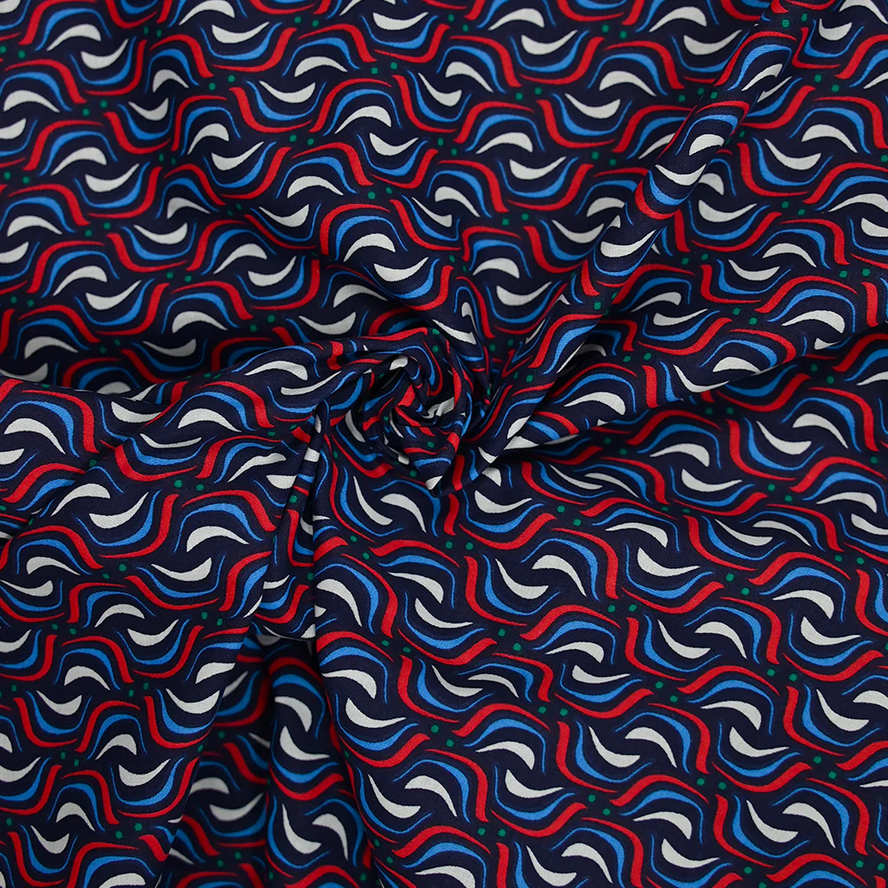 Coton imprimé vague rouge fond marine - Image 2