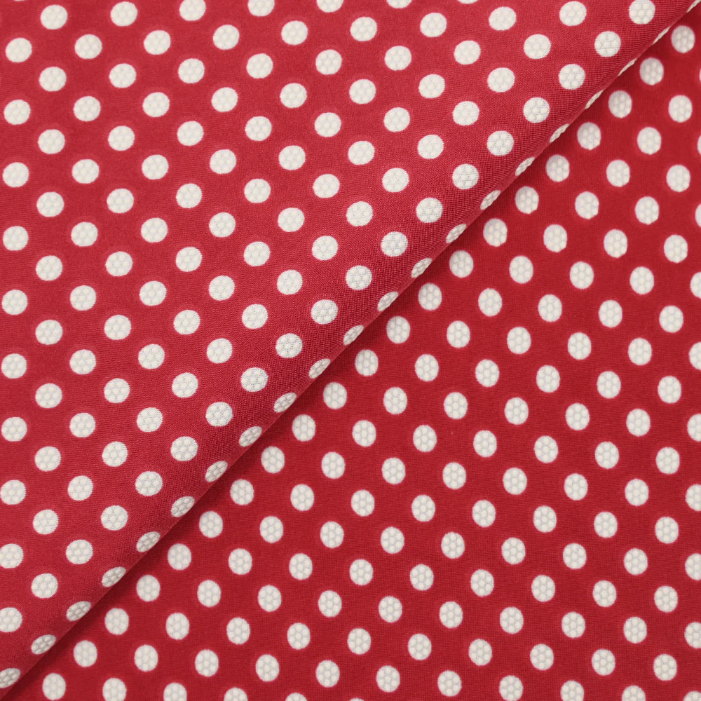 Jersey de polyester floqué et imprimé pois blanc fond rouge