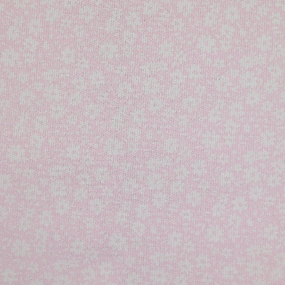 Piqué de coton imprimé fleurs printanière fond rose clair