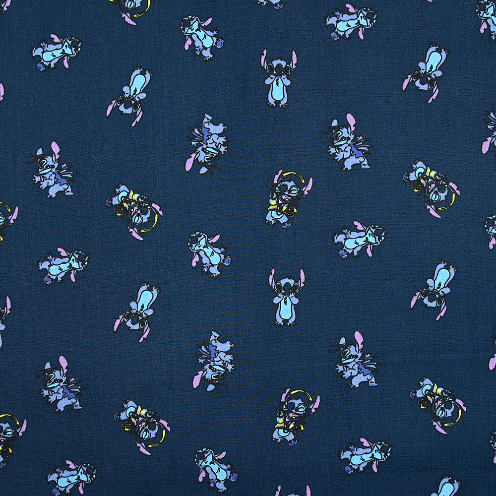Popeline de coton imprimé Stitch fond bleu nuit