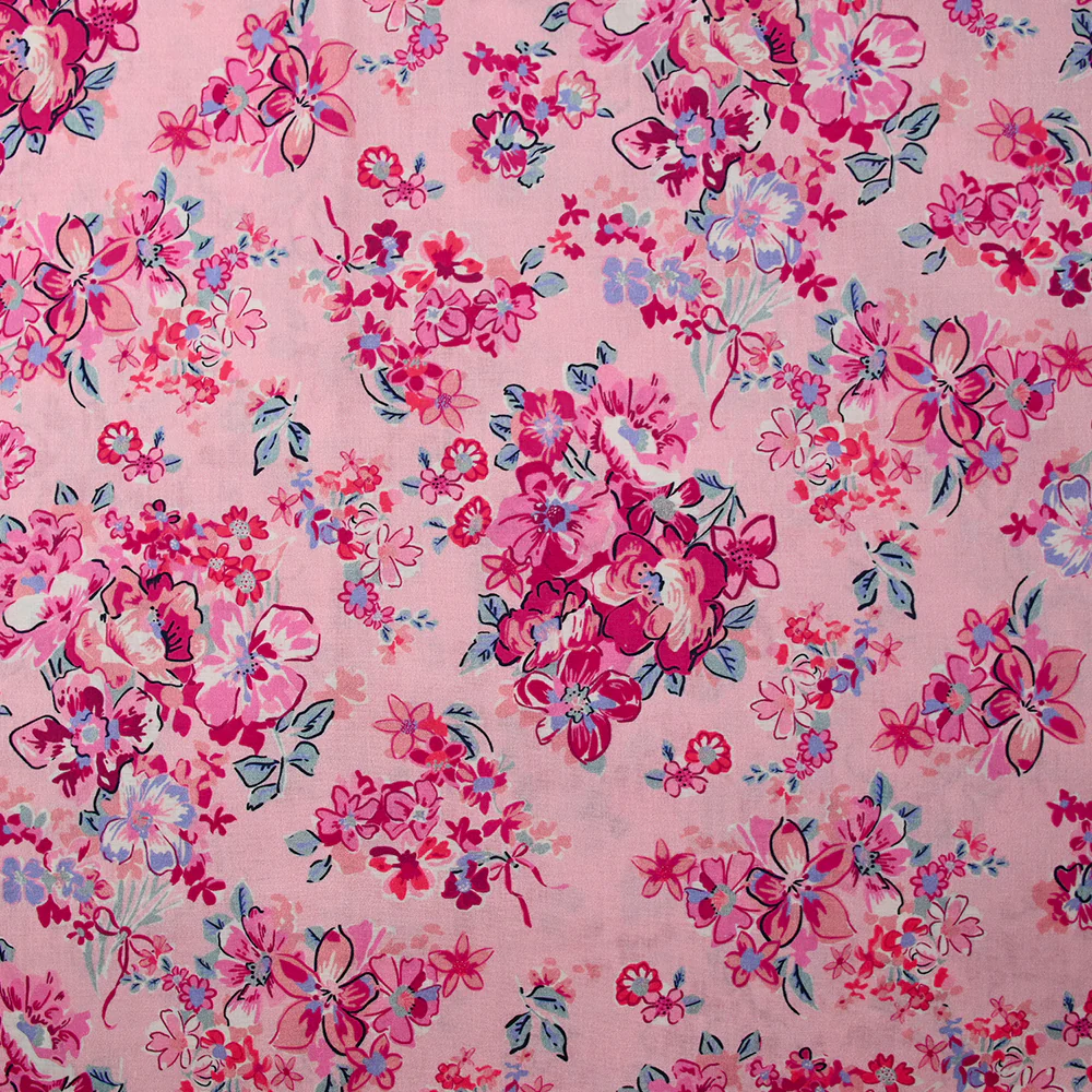 Popeline de coton imprimée bouquet de fleurs fuchsia fond rose dragée