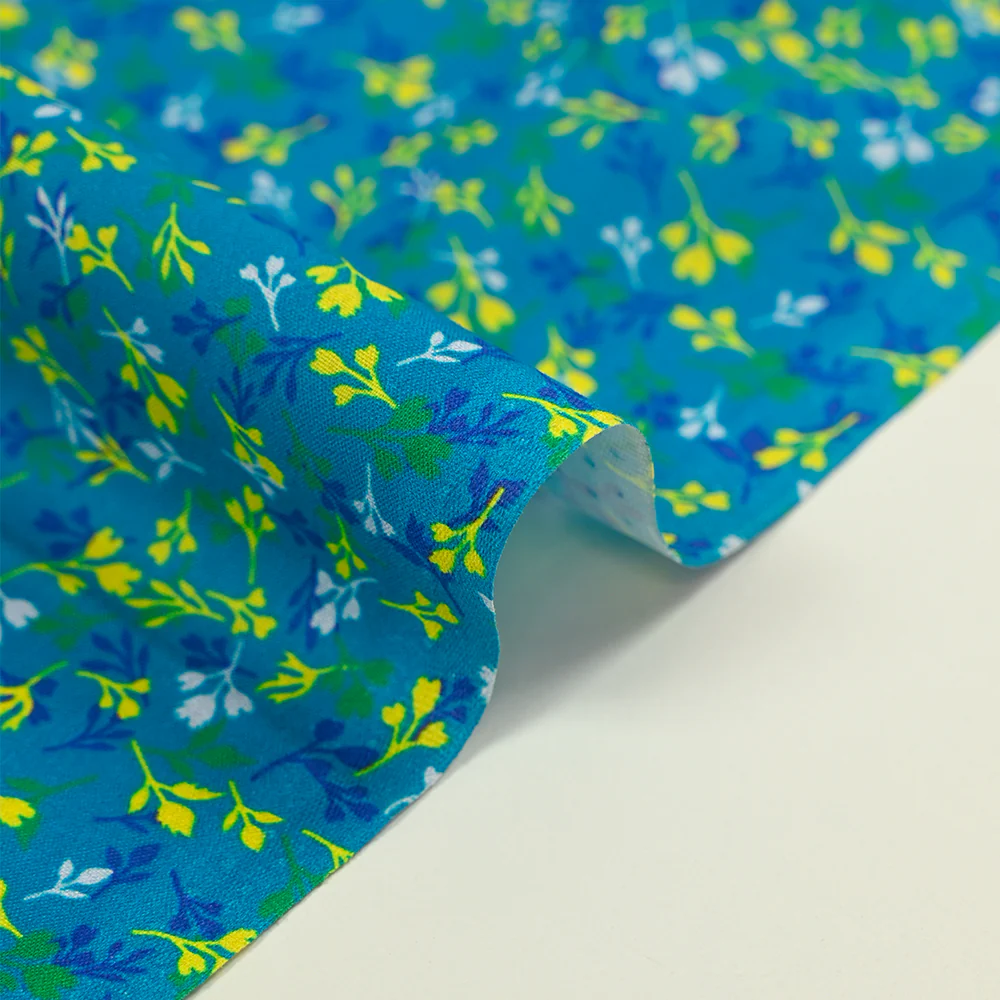 Popeline de coton imprimée bourgeon jaune et bleu fond turquoise - Image 6