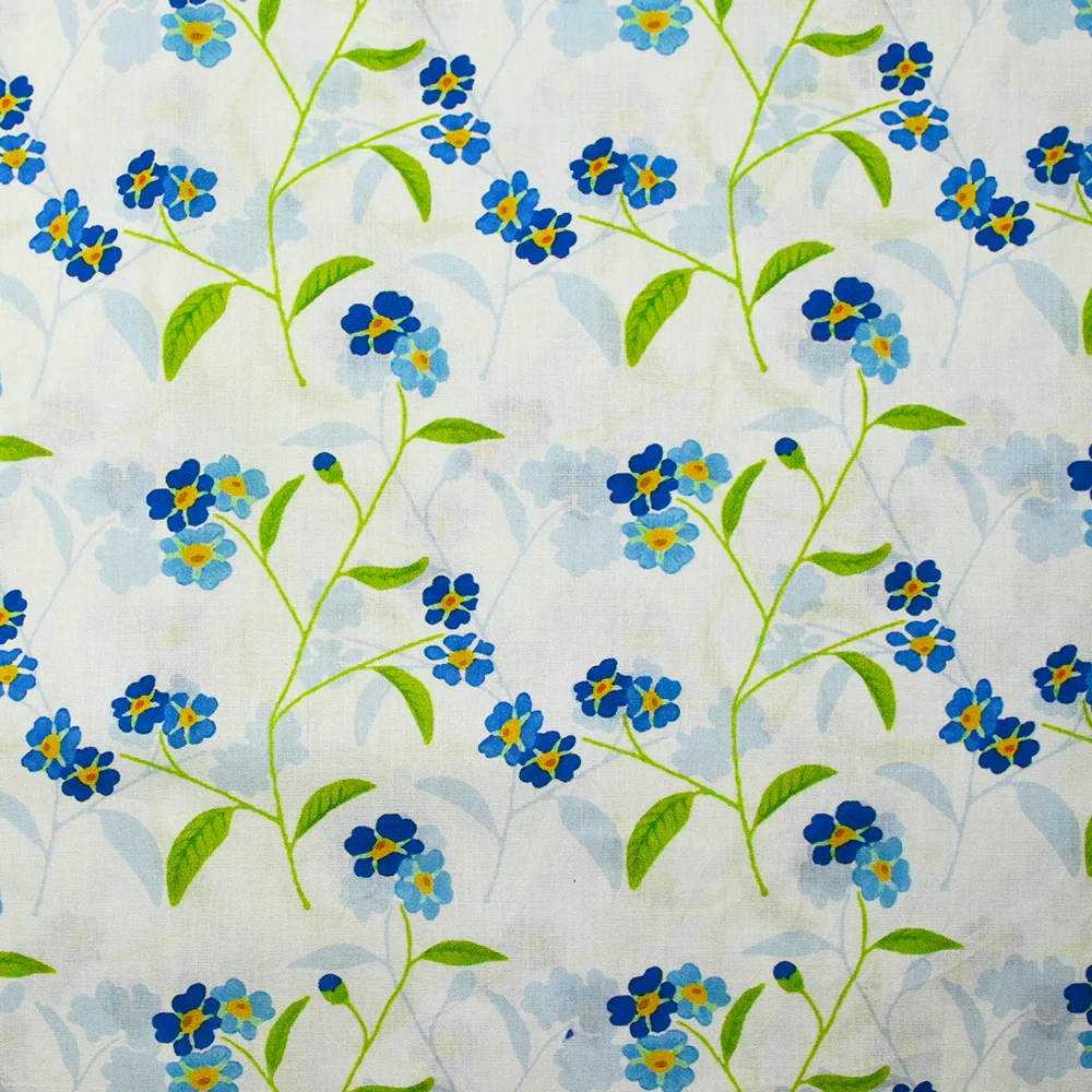 Popeline de coton imprimée fleur bleue et tige verte fond ciel