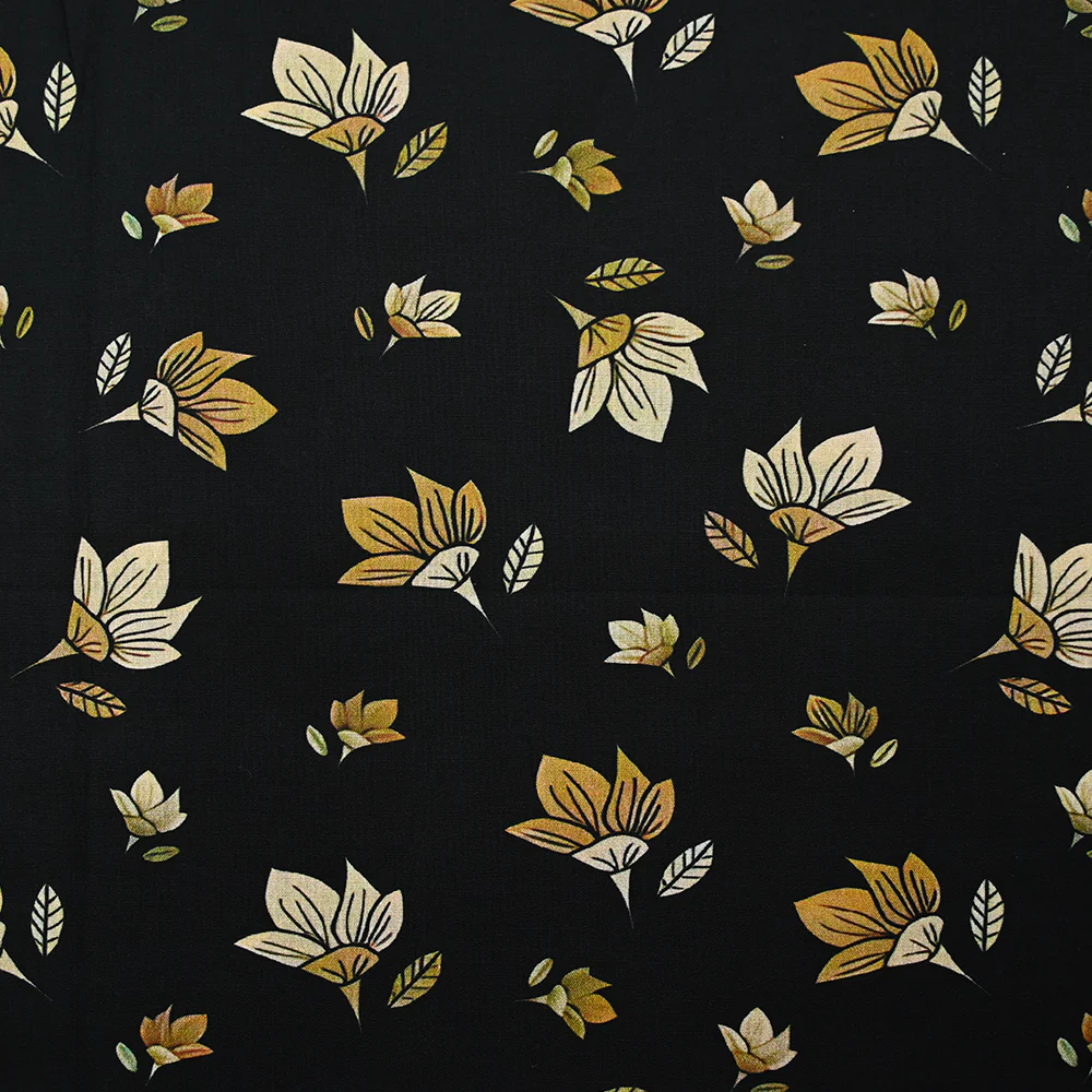 Popeline de coton imprimée fleur jaune pastel et miel fond noir