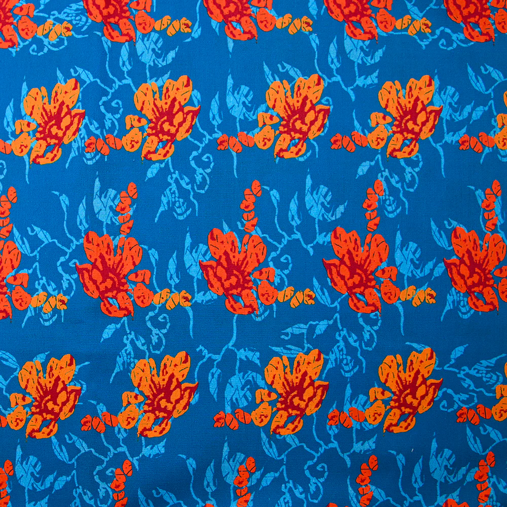Popeline de coton imprimée fleur stylisée orange fond turquoise
