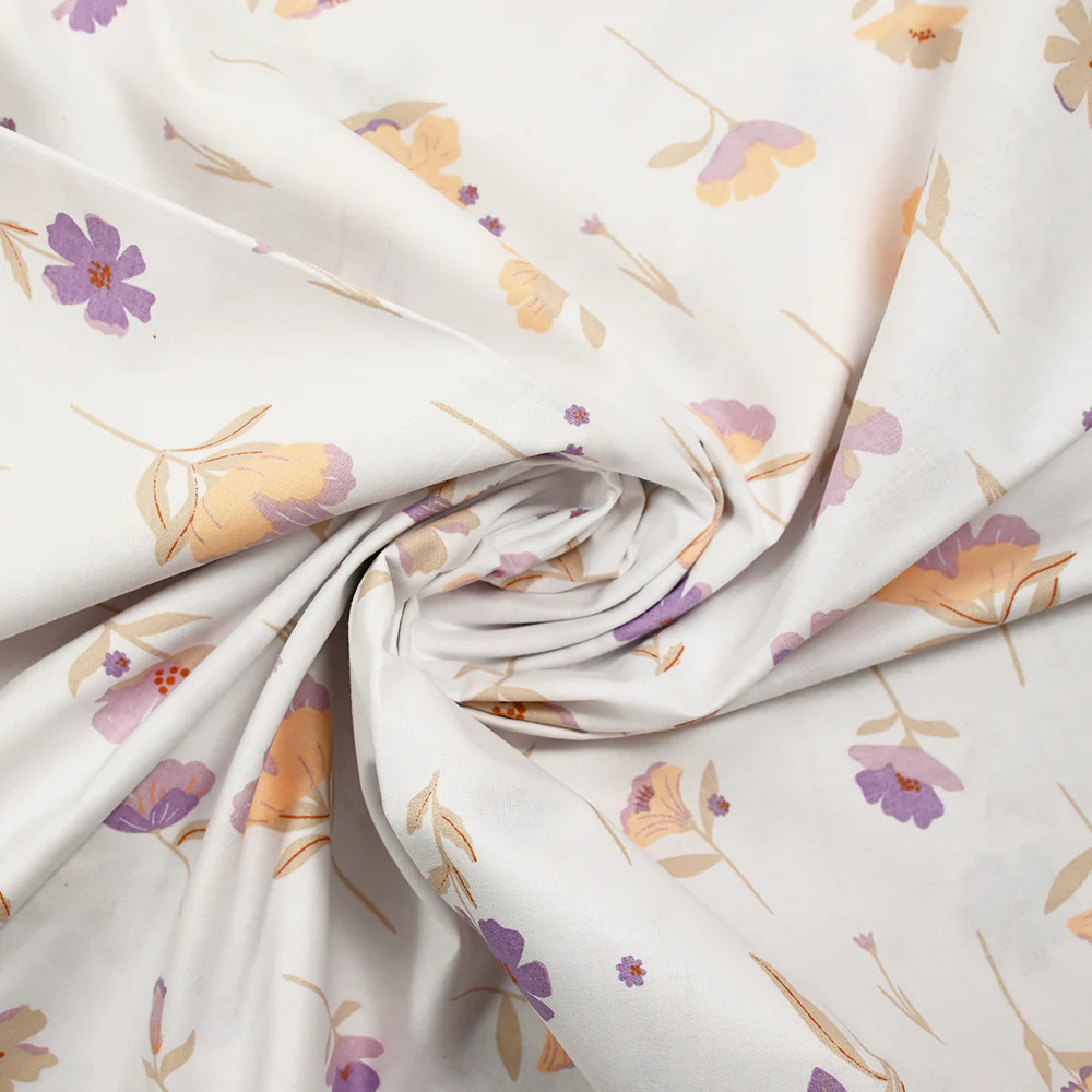 Popeline de coton imprimĂ©e fleurs pastel mauve et pĂȘche fond blanc - Image 2