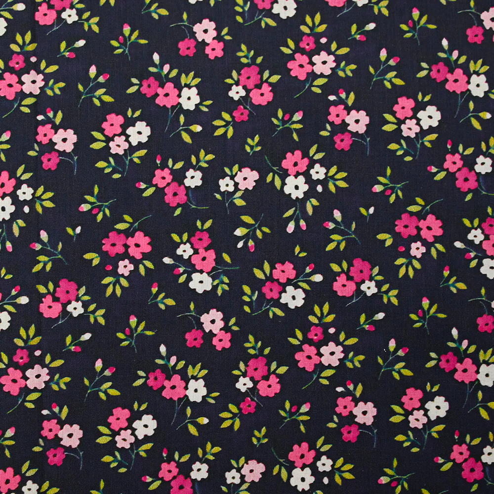 Popeline de coton imprimée mini fleur rose fond bleu minéral