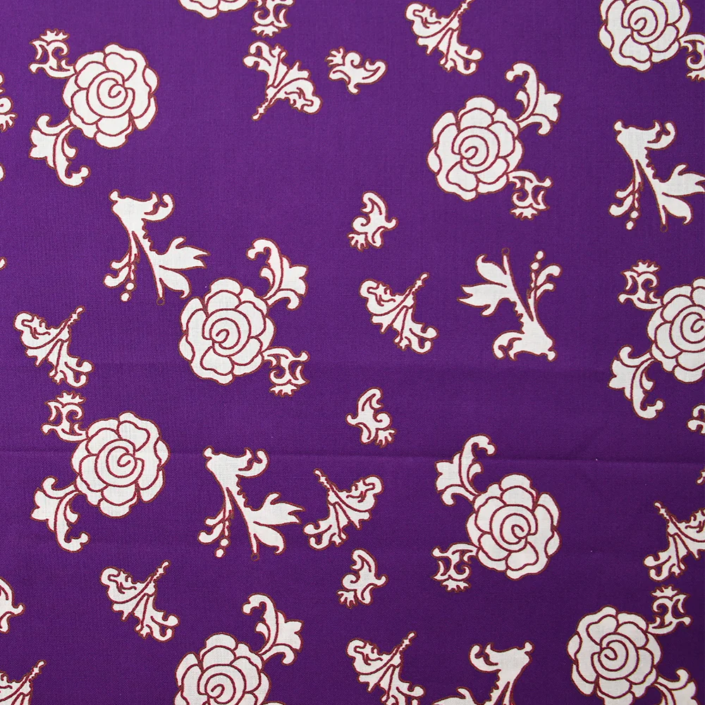 Popeline de coton imprimée ornemental marron fond violet