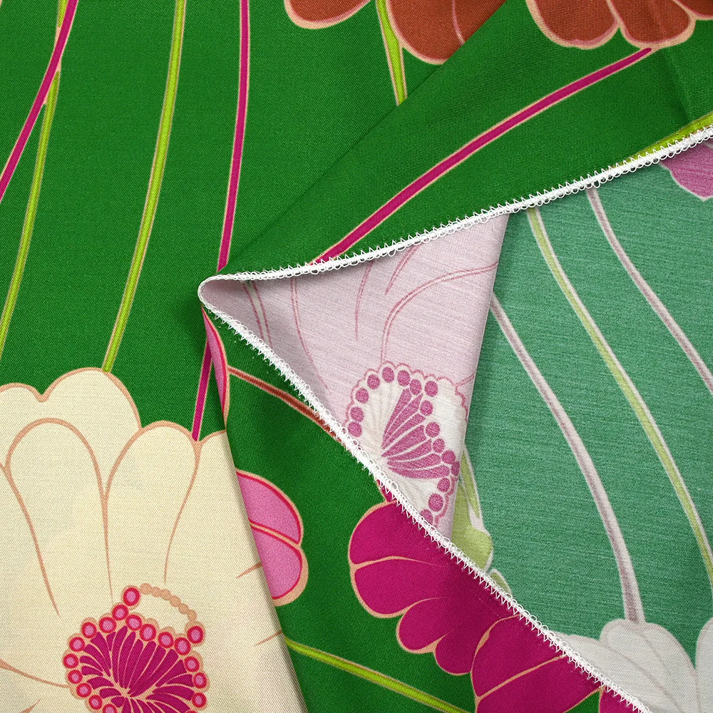 Twill de viscose imprimé en fleurs anis et fuchsia fond vert prairie - Image 7