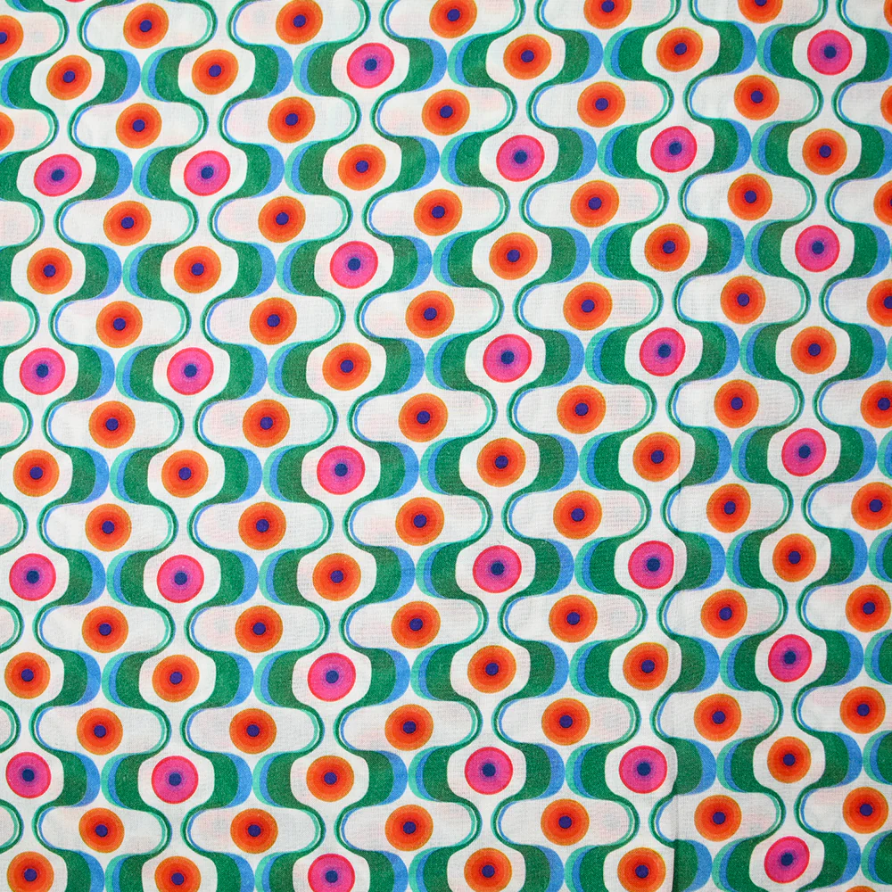 Viscose imprimée agitation verte et orange fond blanc