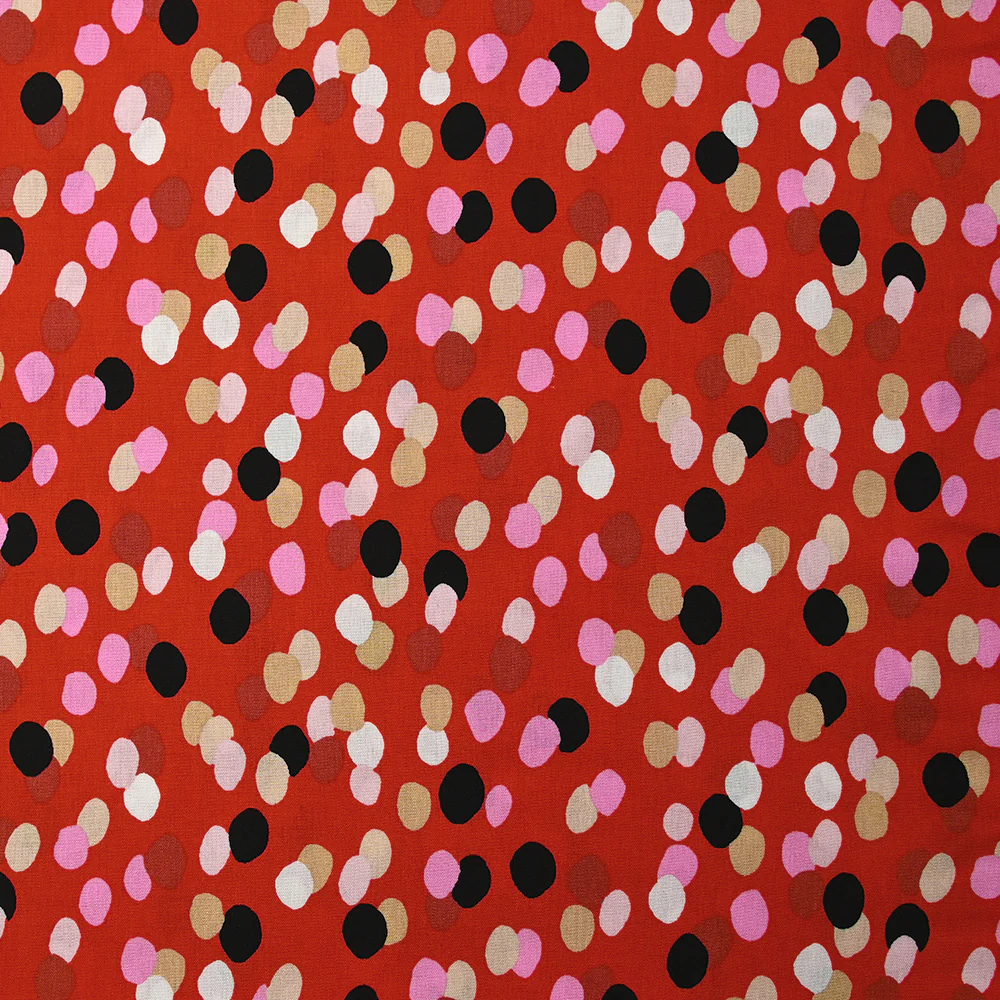 Viscose imprimée confettis noir, rose et beige fond rouge