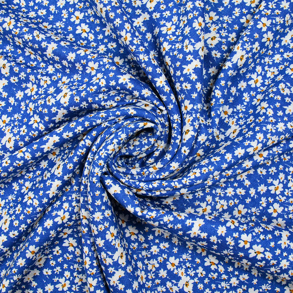 Viscose imprimée fleurs blanches et jaunes fond bleu - Image 2