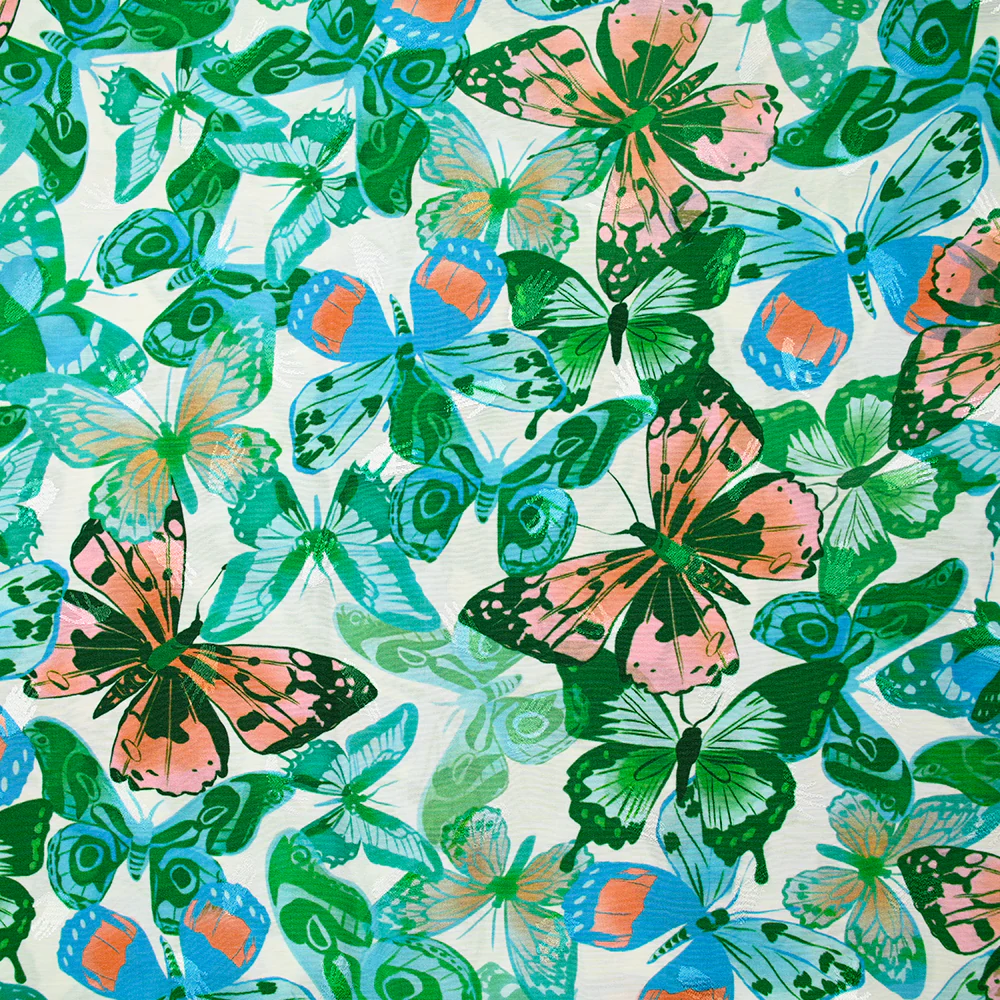 Viscose imprimée jacquard papillons bleus et verts fond blanc