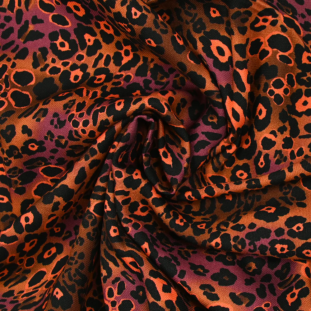 Viscose imprimée léopard orange fluo fond marron - Image 2